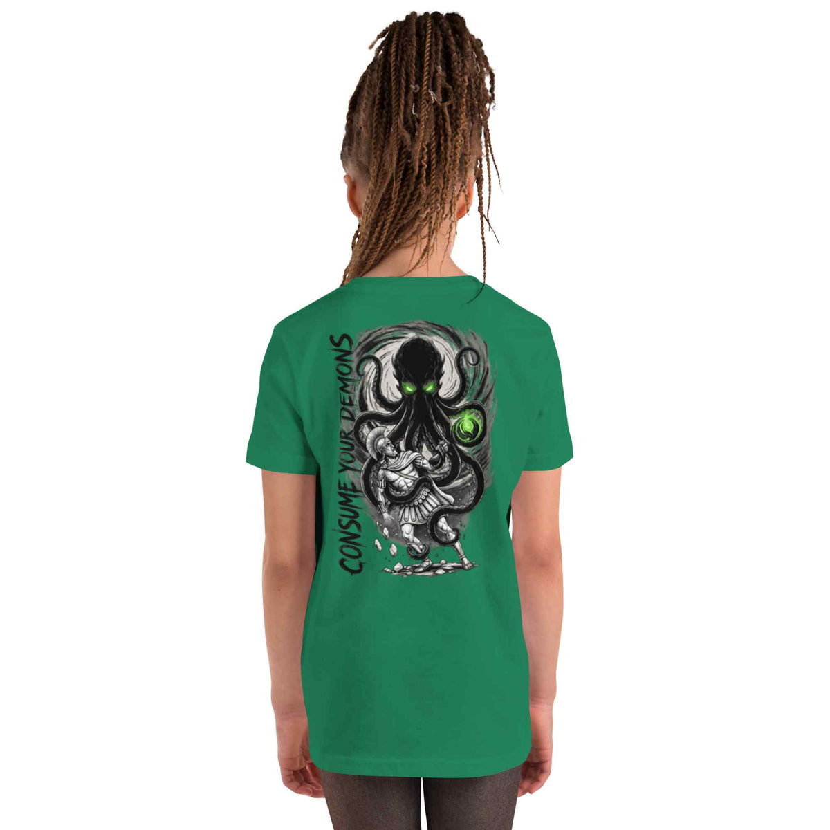 A child model shown from the back wearing a green t-shirt with a large black and white octopus graphic and the text 'CONSUME YOUR DEMONS' printed on the back.