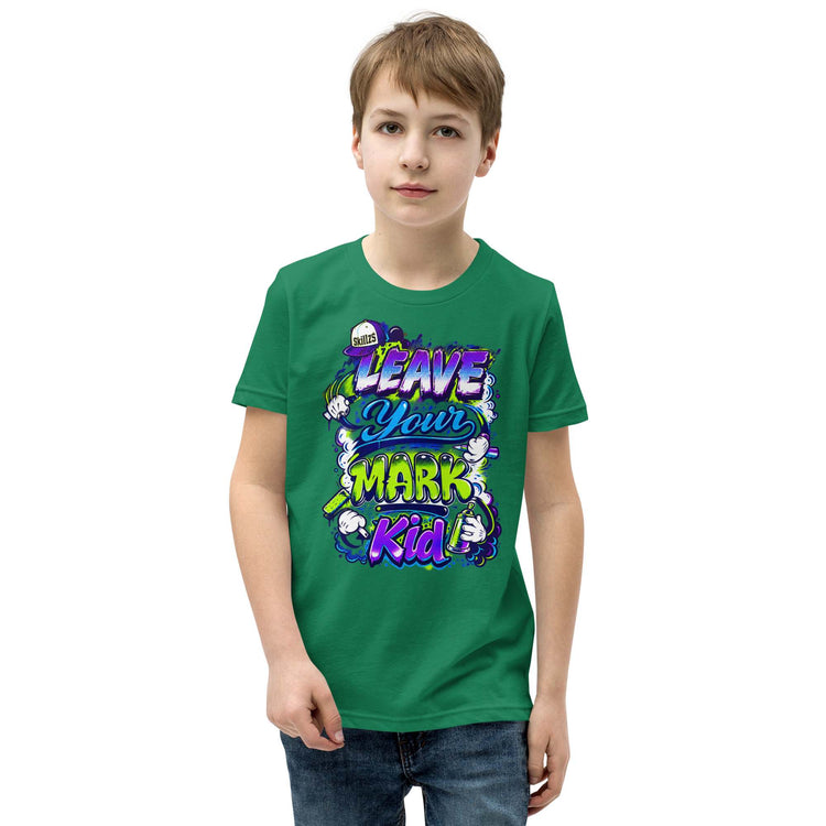 A young boy wearing a green crewneck t-shirt with a colorful graphic that reads 'LEAVE YOUR MARK Kid' in stylized purple, blue, and yellow lettering, set against a plain white background.