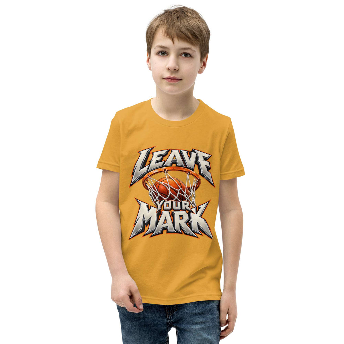 A young boy wearing a mustard yellow t-shirt with a custom graphic that reads 'LEAVE YOUR MARK' around a basketball and hoop, set against a plain white background.