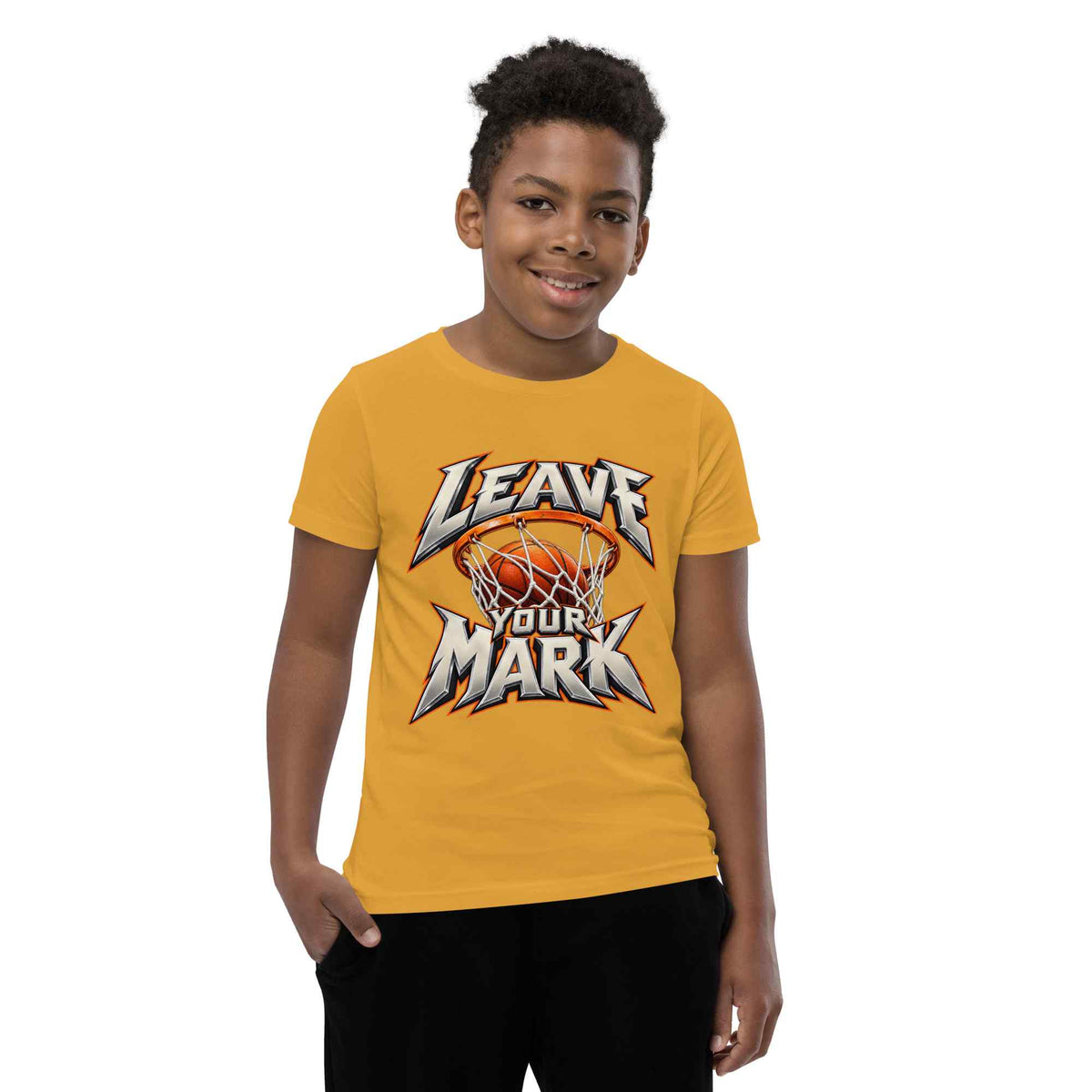 A young boy wearing a yellow t-shirt with a 'LEAVE YOUR MARK' basketball graphic, standing against a plain white background.