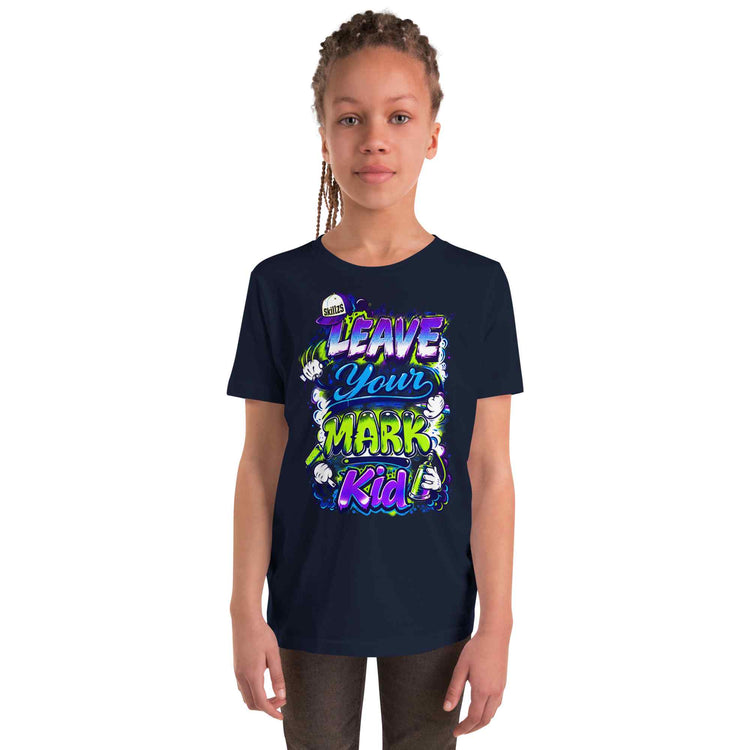 a kid wearing a navy blue t-shirt with a graphic Leave Your Mark Kid design on a white background