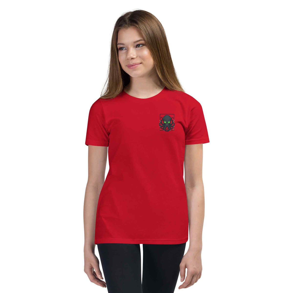 Person wearing a red t-shirt with a small  kraken logo on a white background
