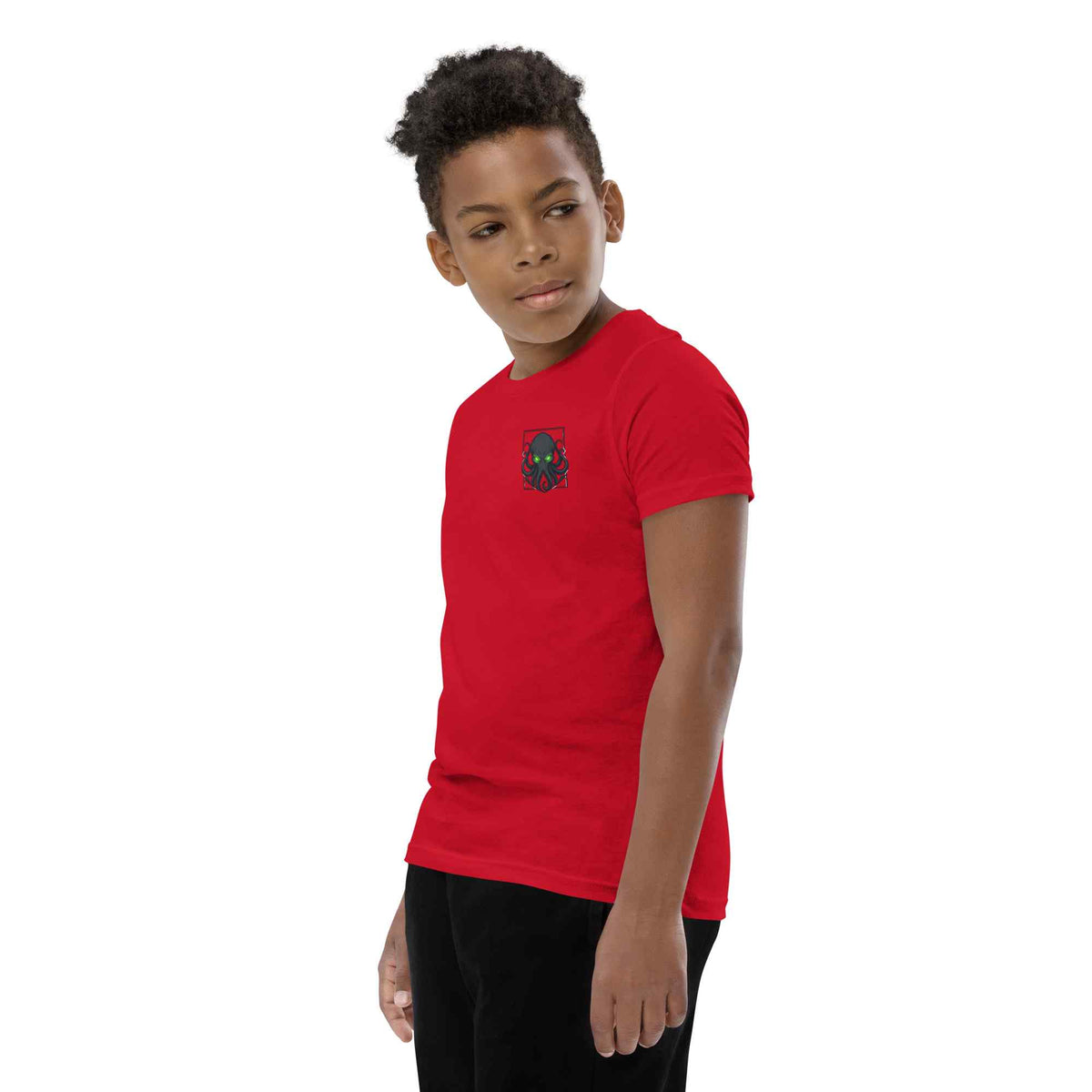 Child wearing a red t-shirt with a kraken logo on a white background