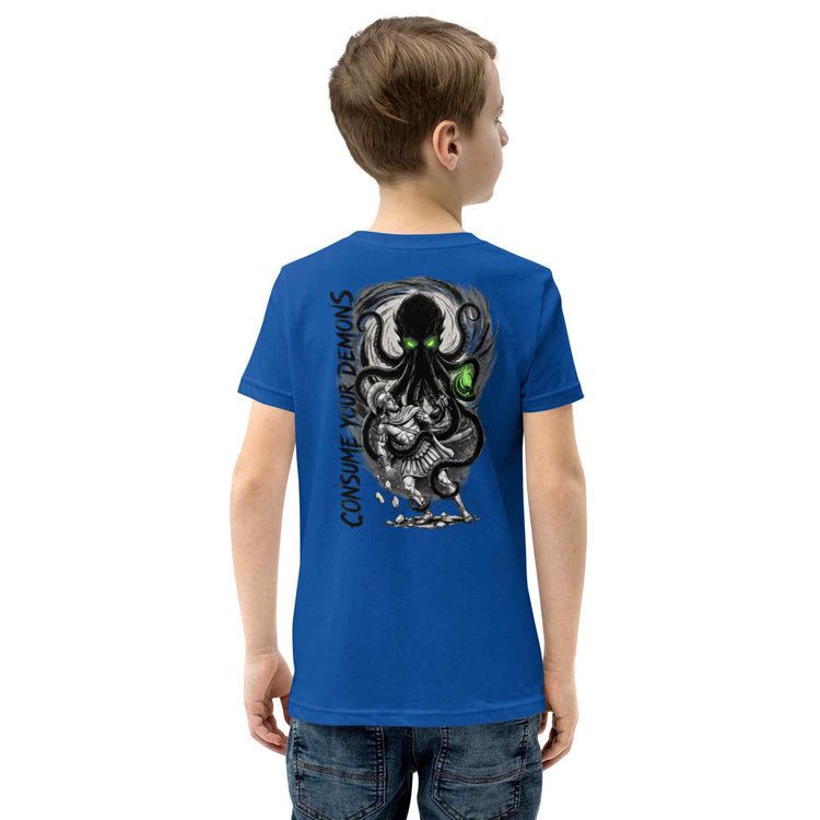 A child model shown from the back wearing a royal blue t-shirt with a large black and gray octopus graphic and green eyes on the back, paired with blue jeans against a plain white background.