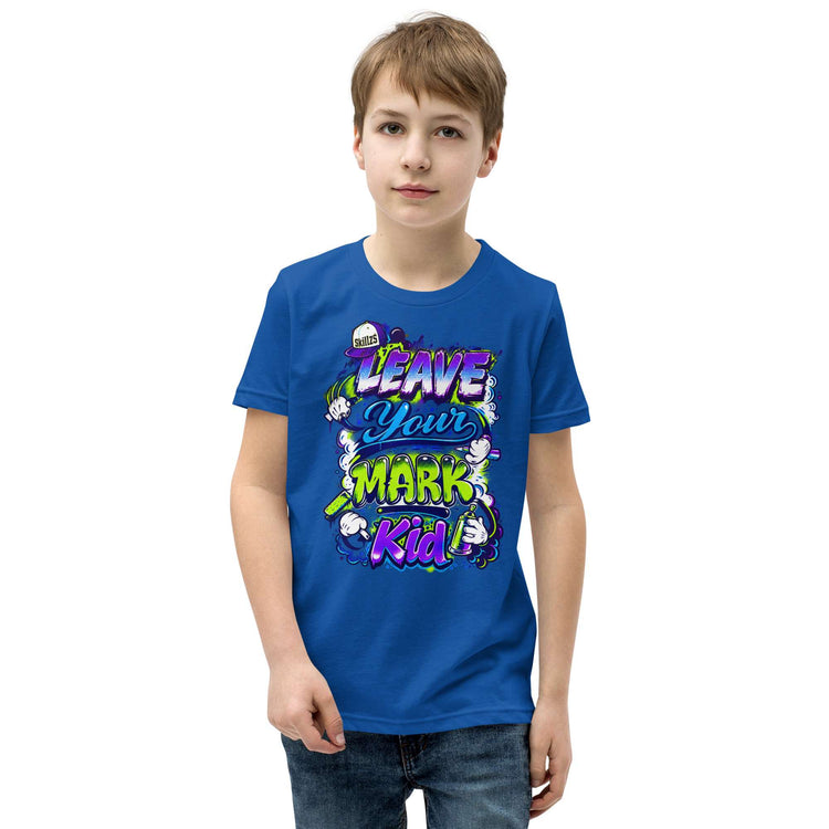 A young boy wearing a royal blue t-shirt with a colorful graphic that reads 'LEAVE YOUR MARK Kid' in stylized lettering, set against a plain white background.