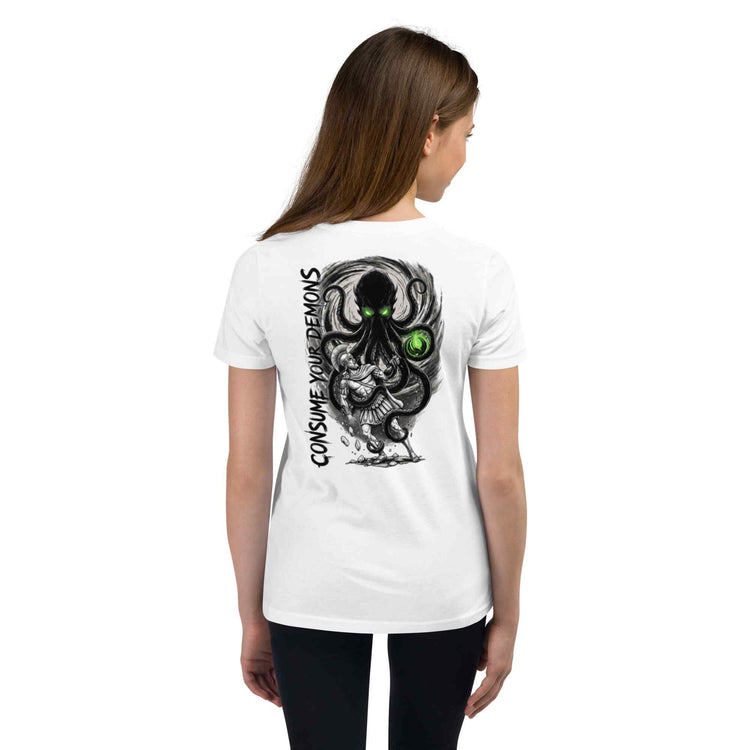 a girl  wearing a white t-shirt with a kraken ' text consuming your demons on the back, standing against a white background