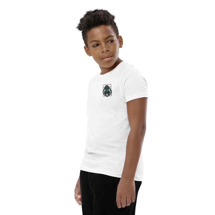 Person wearing a white t-shirt with a kraken logo on a white background
